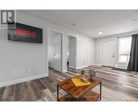 A living room with a Netflix sign on the wall.