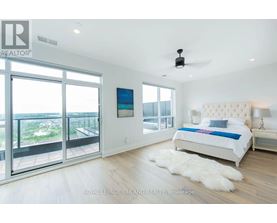 A bedroom with a large bed and a view of the outside.