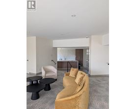 A living room with a sofa, chair, and coffee table.