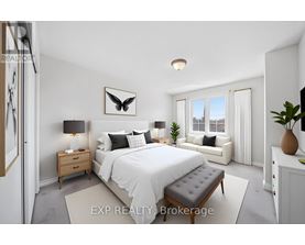 A bedroom with a large bed, a nightstand, and a window seat.