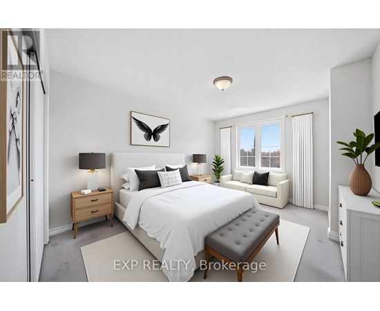A bedroom with a large bed, a nightstand, and a window seat.