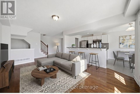 A living room with a grey sofa and a wooden coffee table.