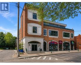 A building with a sign that says EXP REALTY Brokerage.