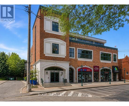 A building with a sign that says EXP REALTY Brokerage.