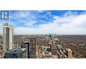 A cityscape with a clear sky and buildings of various heights.