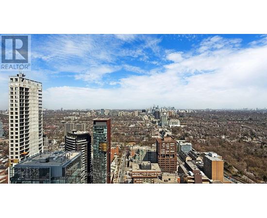 A cityscape with a clear sky and buildings of various heights.