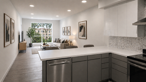 A modern kitchen with a large island and stainless steel appliances.
