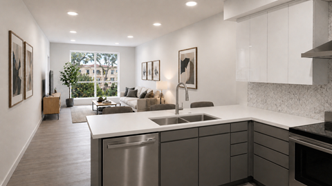 A modern kitchen with a large island and stainless steel appliances.