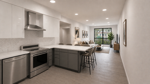 A modern kitchen with stainless steel appliances and a dining area.