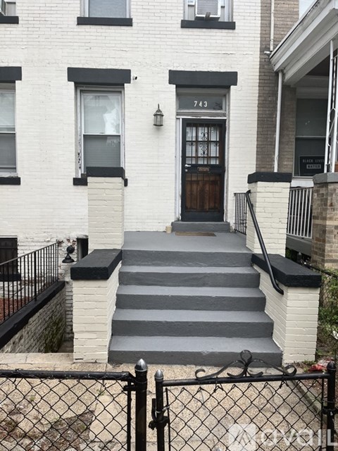 A black and white house with the number 743 on the front.