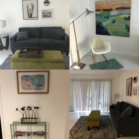 A living room with a grey couch, a green ottoman, a painting, and a lamp.