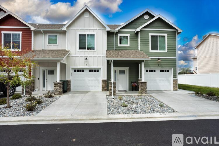 A modern two-story house with a garage is available for sale.