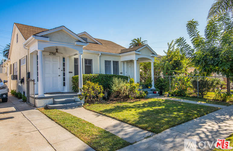 A house with a white front door and a porch.