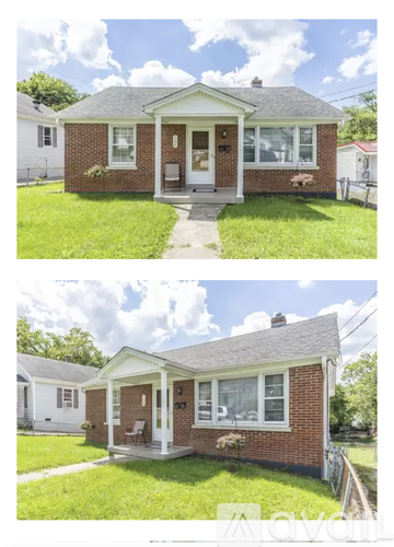 A small brick house with a white door and windows.