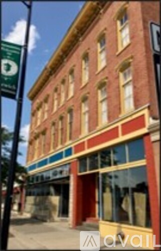 A building with a red and yellow facade is shown.