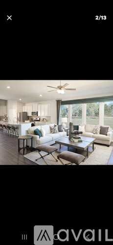 A modern living room with a large sofa set and a coffee table.