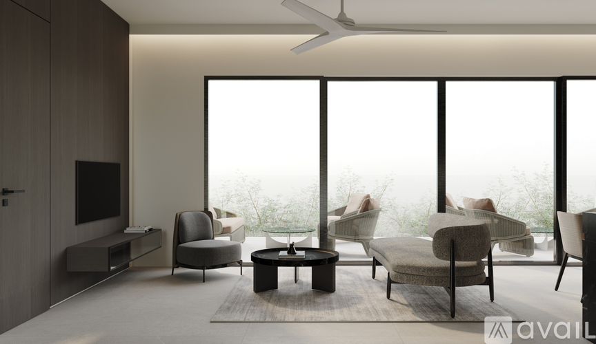 A modern living room with a flat screen TV and comfortable seating.
