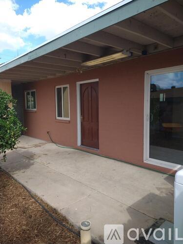 A house with a brown door and a window.