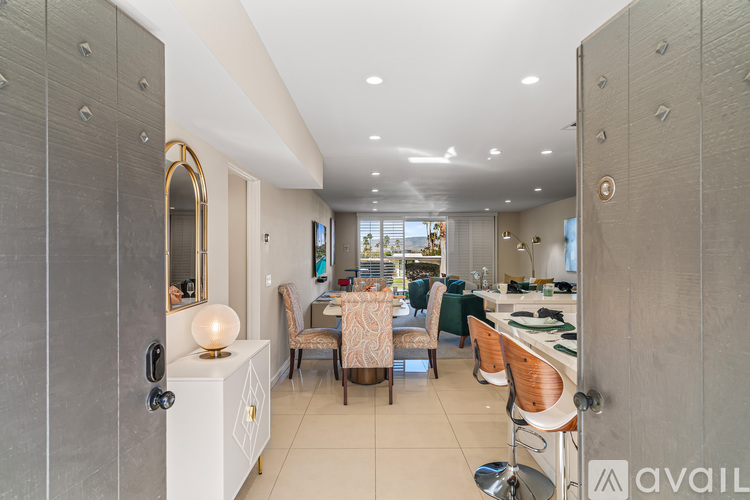 A modern kitchen with a dining table set up.