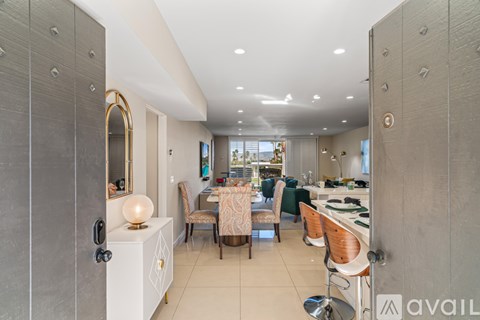 A modern kitchen with a dining table set up.