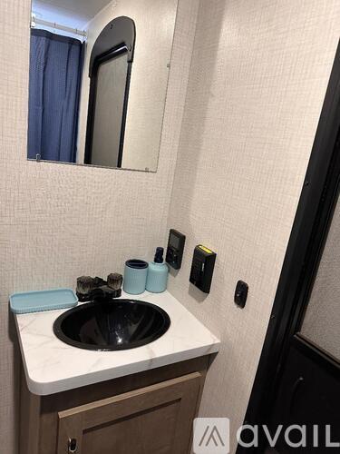 A bathroom sink with a mirror above it.