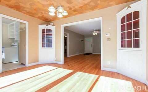 A room with a striped rug on the floor.