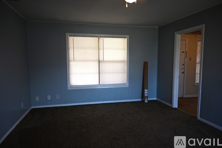 A room with a window and a door.