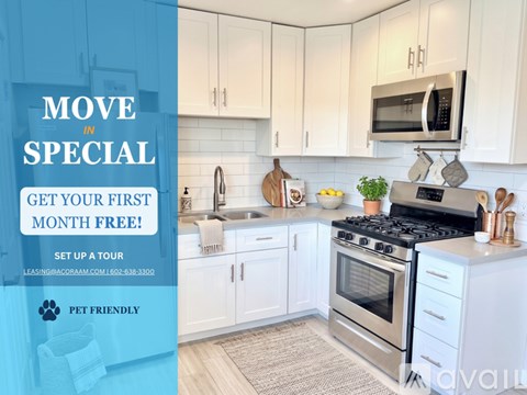 A kitchen with a sign offering a free first month for a tour.