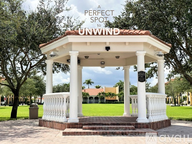 A gazebo with the words "A PERFECT SPOT TO UNWIND" written on it.