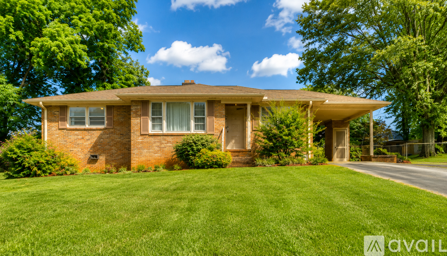 A house with a lawn in front of it.