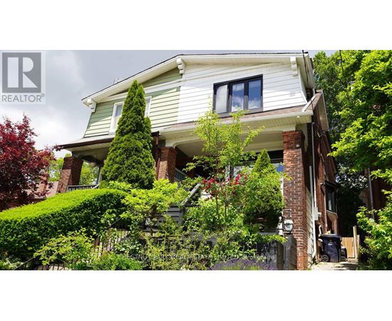 A house with a well-maintained garden in front.
