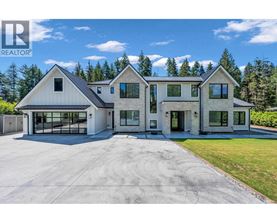 A large house with a garage is for sale.