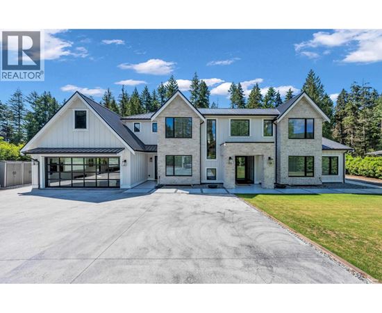 A large house with a garage is for sale.