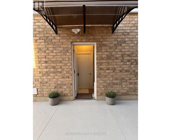 A white door with a black mat in front of it.