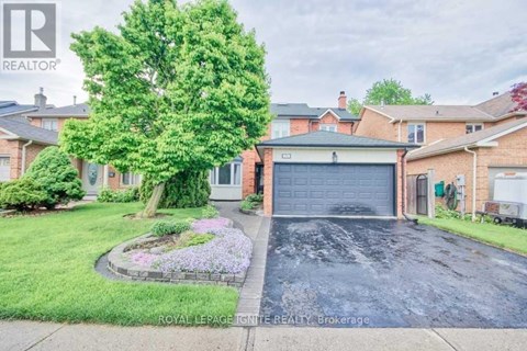 A house with a Royal LePage REALTOR® sign in front.
