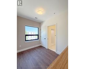 A room with a window and a door.