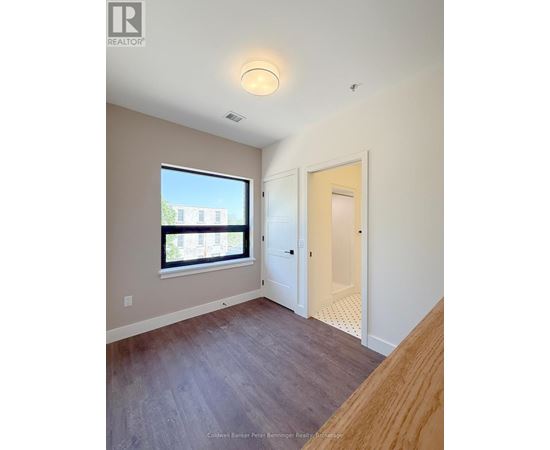 A room with a window and a door.