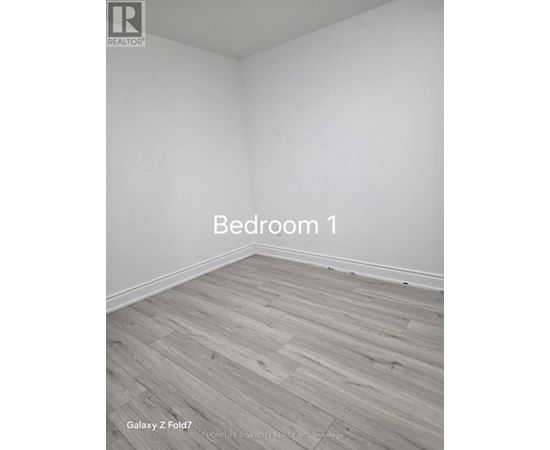 Bedroom 1 with Galaxy Z Fold7 flooring.