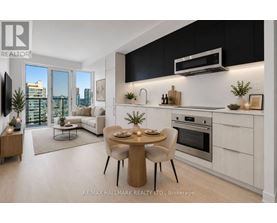 A modern kitchen with a dining table set for two.