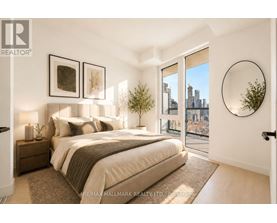 A bedroom with a large bed and a view of the city.