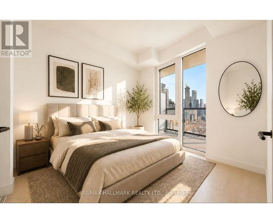A bedroom with a large bed and a view of the city.