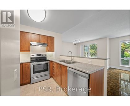 A kitchen with wooden cabinets and stainless steel appliances is on the market.