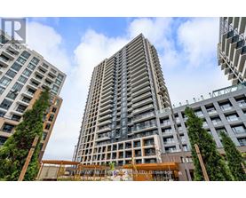 A tall building with a sign that reads "Terrace House" in front of it.