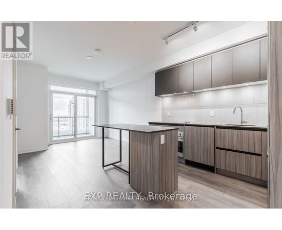A modern kitchen with wooden cabinets and a large island.
