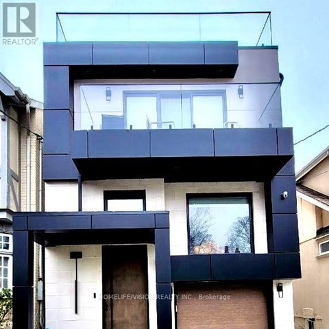 A modern house with a balcony and a window.