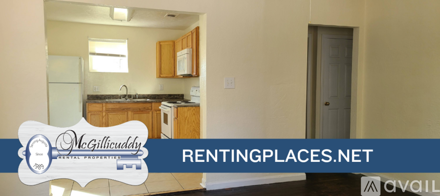 A kitchen with a refrigerator, sink, and cabinets is shown in a rental property advertisement.