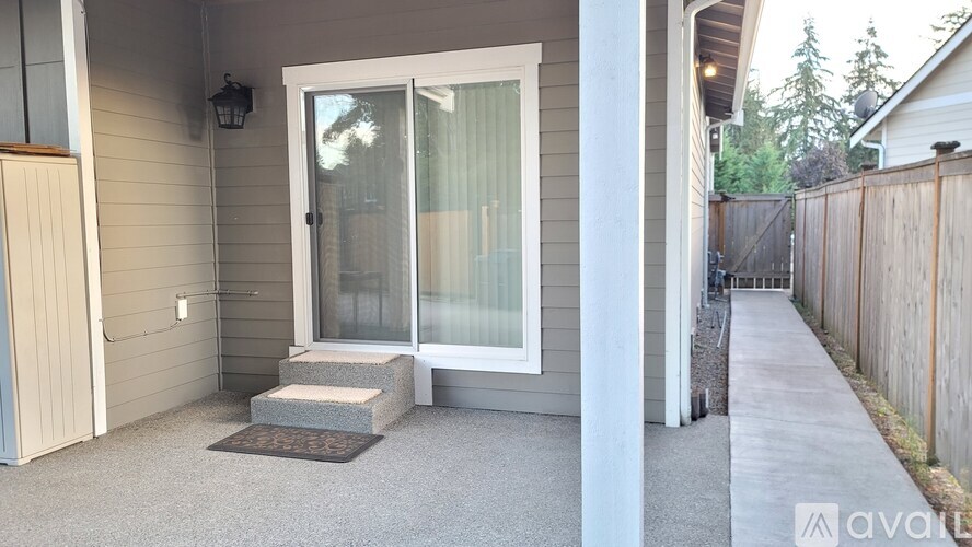 A house with a glass door and a small porch.