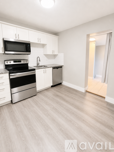 A kitchen with a stove top oven and microwave.