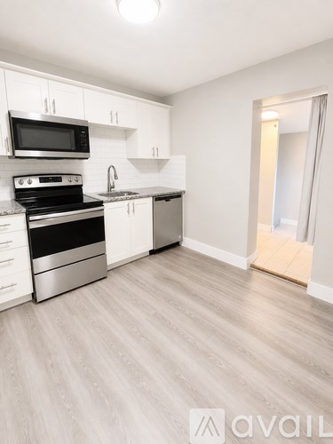 A kitchen with a stove top oven and microwave.