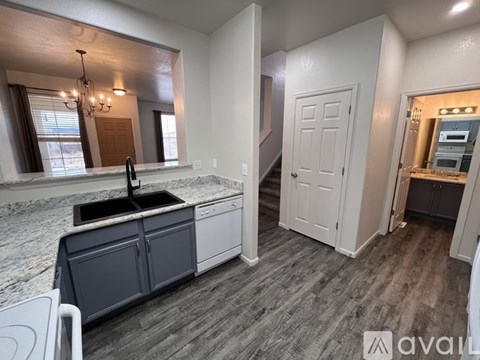 A kitchen with a sink and a countertop.